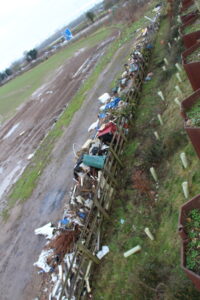 Fly tipping in the field nearby